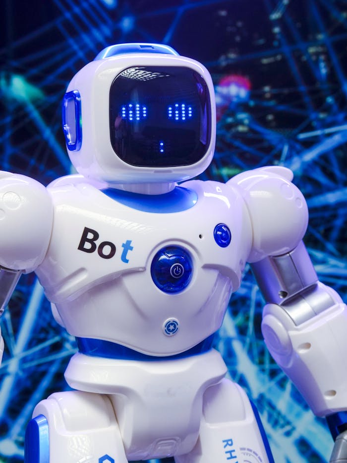 gallery-01 A humanoid robot with advanced blue LED eyes and sleek white design.